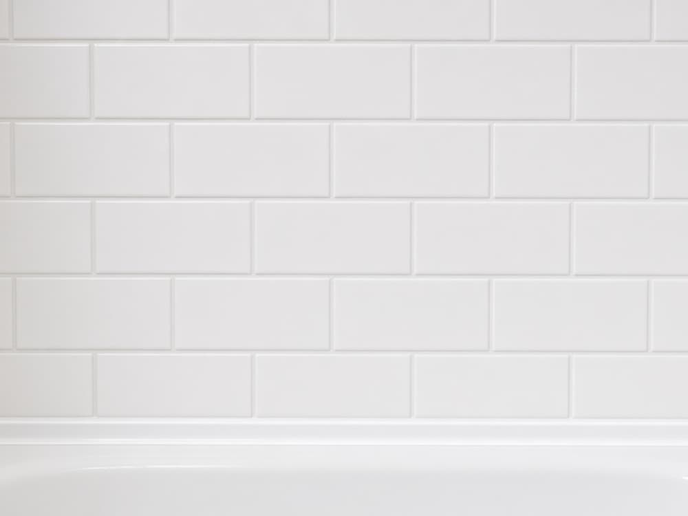 Illustration of a subway tile tub wall after restoration